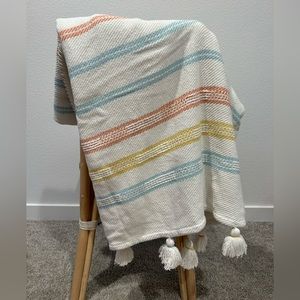 Cream, blue, orange, yellow striped throw blanket